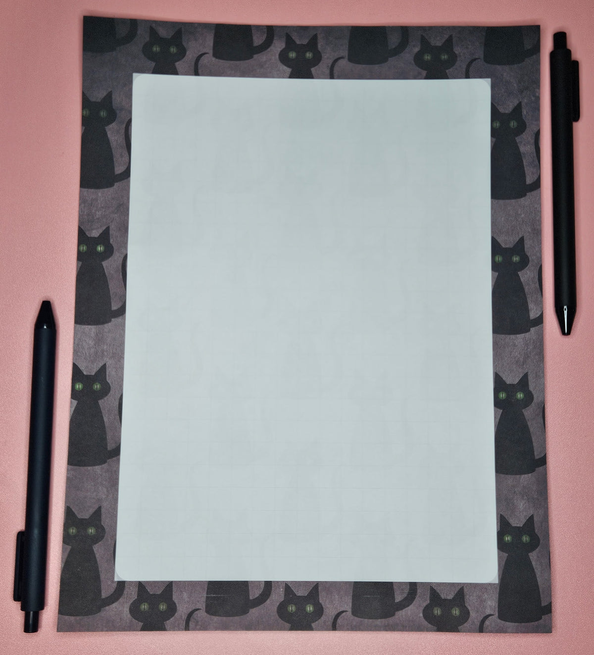 loose leaf sheet with black cats printed all over