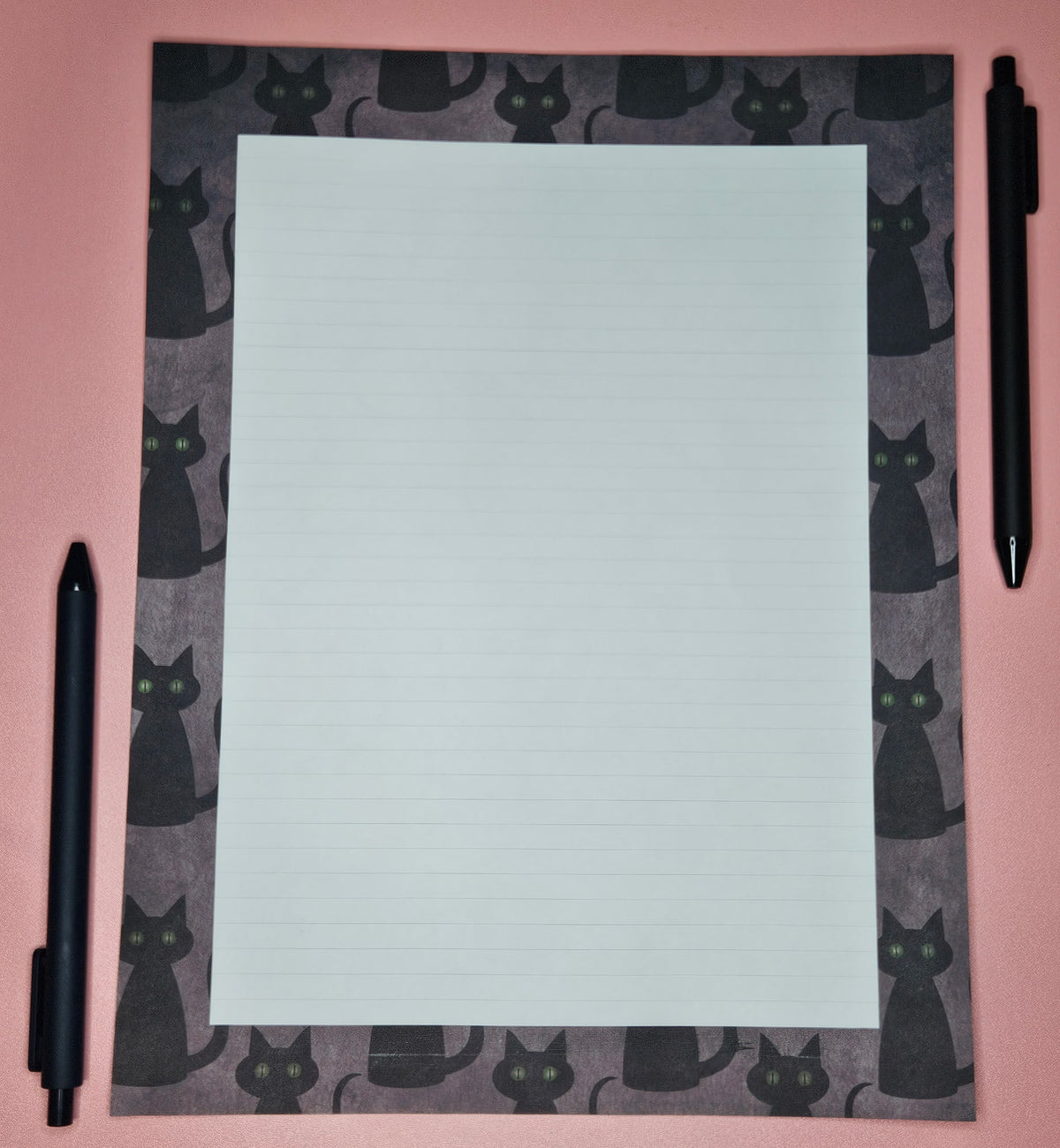 loose leaf sheet with black cats printed all over