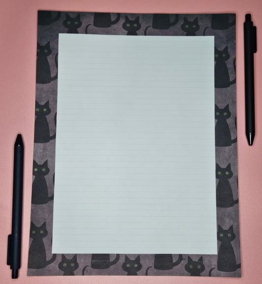 loose leaf sheet with black cats printed all over
