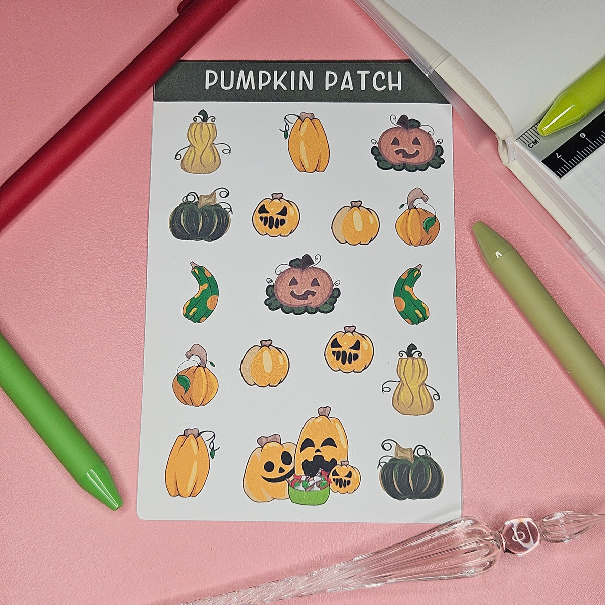 sticker sheet with a variety of pumpkins with and without faces 
